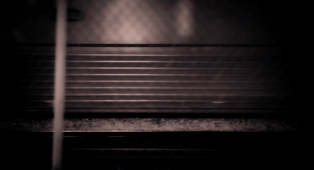Wide shot frame from Bullet to the Head — train, window