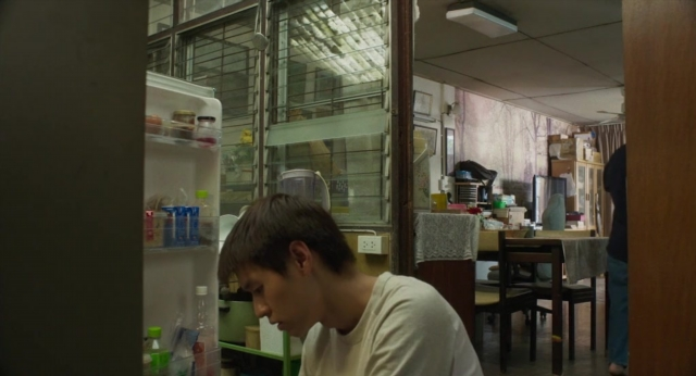 Wide shot frame from Lahn Mah — walking, kitchen, refrigerator