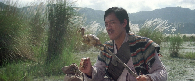 Wide shot frame from Zhong hua zhan shi — sitting, animal, beard