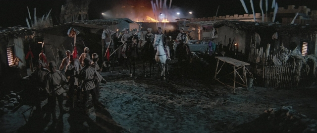 Wide shot frame from Zhong hua zhan shi — fire, night, smoke