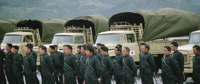 Wide shot frame from Zhong hua zhan shi — standing, walking, car