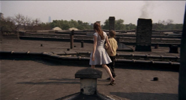 Wide shot frame from Medium Cool — walking, dress, shirt