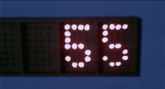 Frame from Medium Cool — clock, window