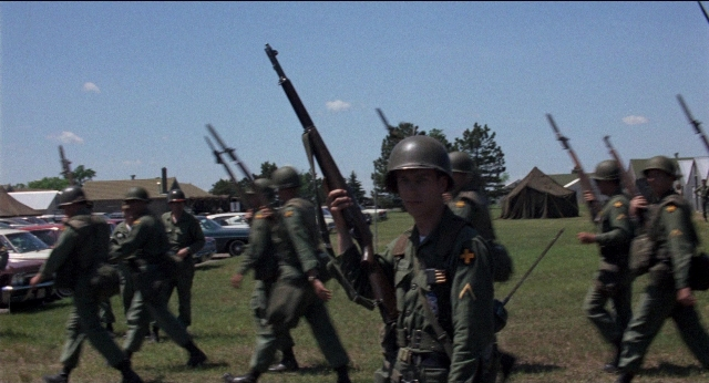 Wide shot frame from Medium Cool — walking, person, human face