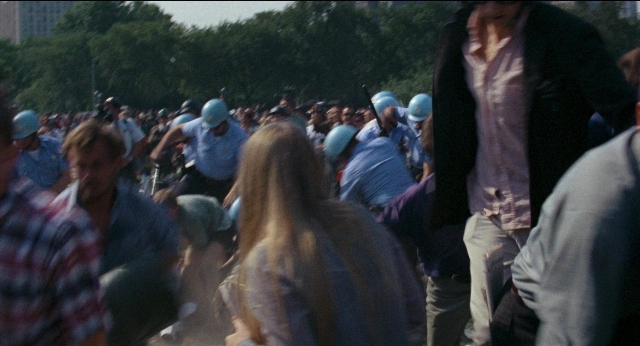 Wide shot frame from Medium Cool — person, human face