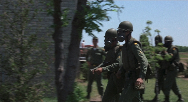 Wide shot frame from Medium Cool — walking, person, human face