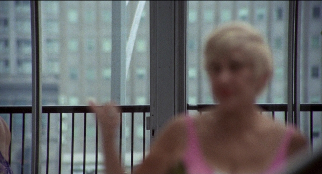 Medium shot frame from Medium Cool — standing, person, human face