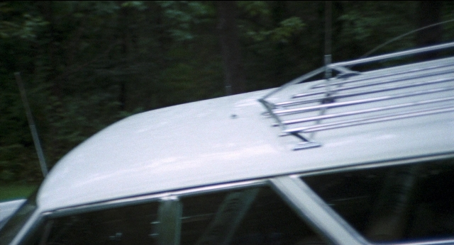 Frame from Medium Cool — car, window, land vehicle
