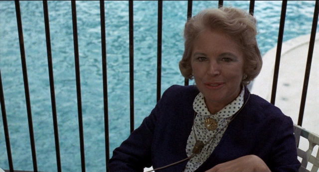 Medium shot frame from Medium Cool — sitting, face, hair