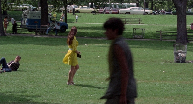Wide shot frame from Medium Cool — sitting, standing, walking