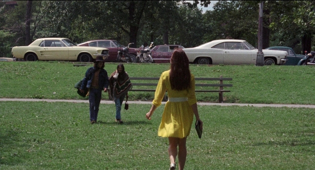 Medium shot frame from Medium Cool — walking, car, hand
