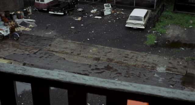 Frame from Medium Cool — street, car, wheel