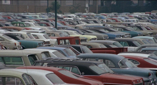 Frame from Medium Cool — car, person