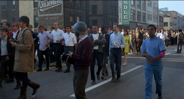 Wide shot frame from Medium Cool — walking, street, person