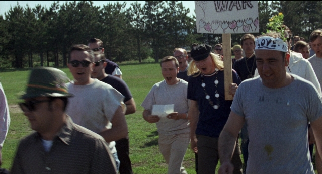 Medium shot frame from Medium Cool — walking, person, human face