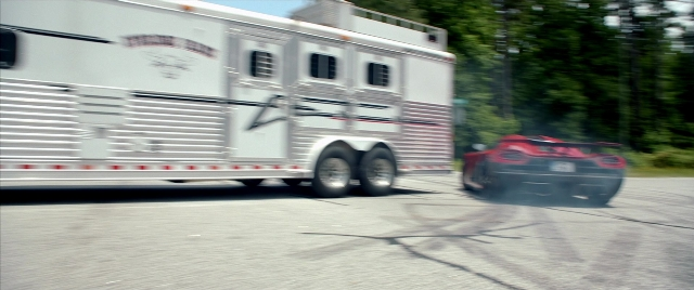 Frame from Need for Speed — door, street, car