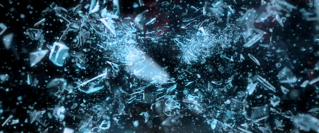 Wide shot frame from Need for Speed — glass, fountain, window