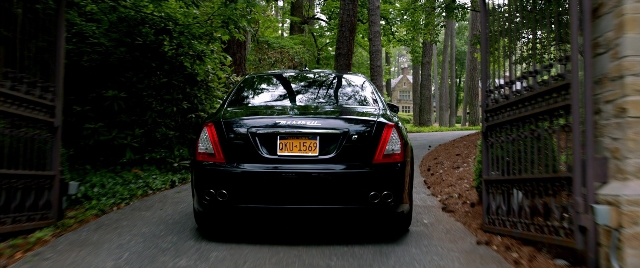 Wide shot frame from Need for Speed — street, car, vehicle registration plate