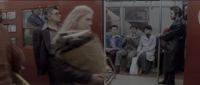 Wide shot frame from Carlito's Way — dialogue, coat, suit