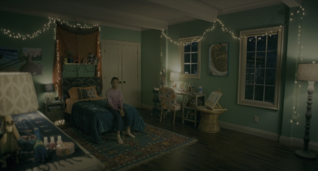 Wide shot frame from Doctor Sleep — sitting, room, table