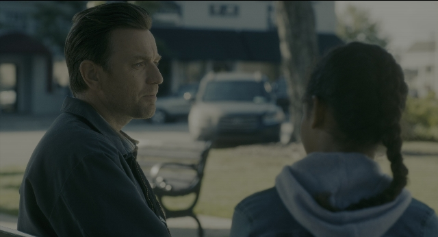 Wide shot frame from Doctor Sleep — sitting, street, car