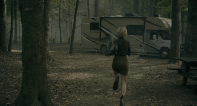 Wide shot frame from Doctor Sleep — walking, table, dress