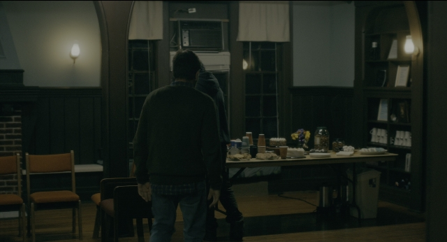 Wide shot frame from Doctor Sleep — standing, plate, room
