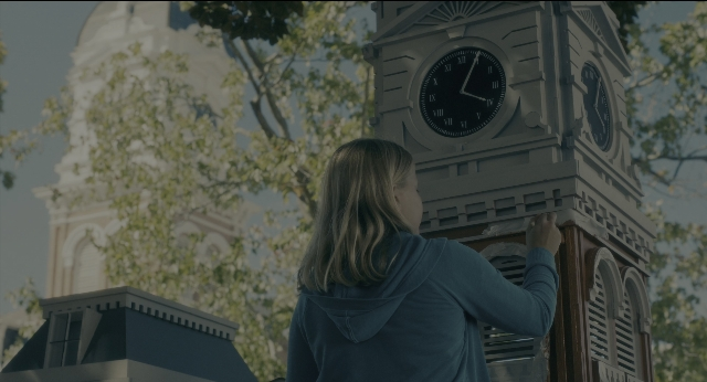 Wide shot frame from Doctor Sleep — standing, tower, face