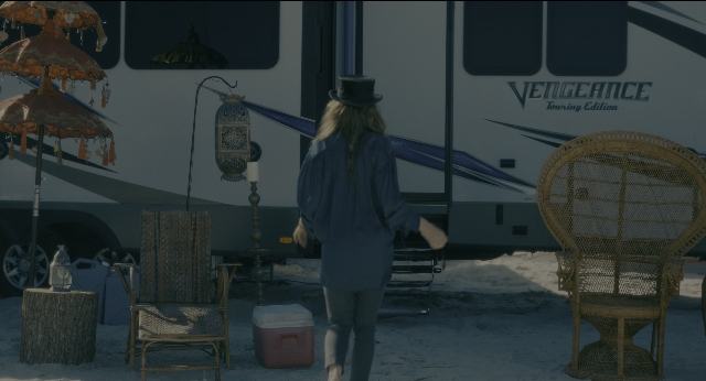 Wide shot frame from Doctor Sleep — walking, table, hat