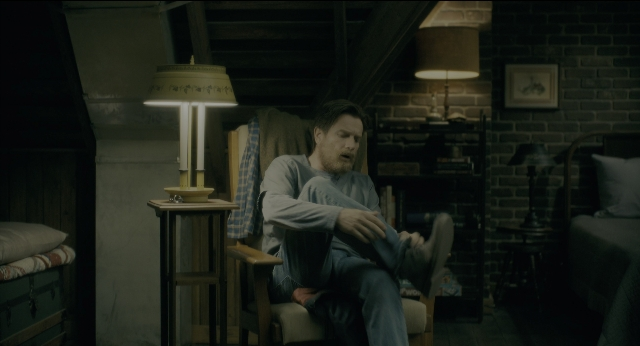 Wide shot frame from Doctor Sleep — sitting, room, table