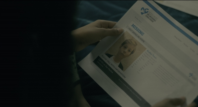 Wide shot frame from Doctor Sleep — hand, hair, bird