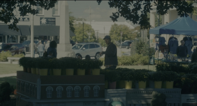 Wide shot frame from Doctor Sleep — standing, walking, table