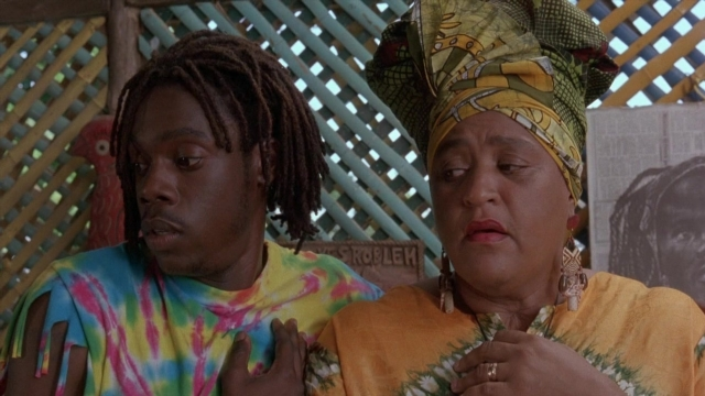 Medium shot frame from Cool Runnings — sitting, room, tie