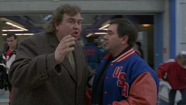 Wide shot frame from Cool Runnings — standing, walking, dialogue