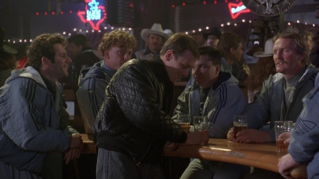 Wide shot frame from Cool Runnings — sitting, table, dialogue
