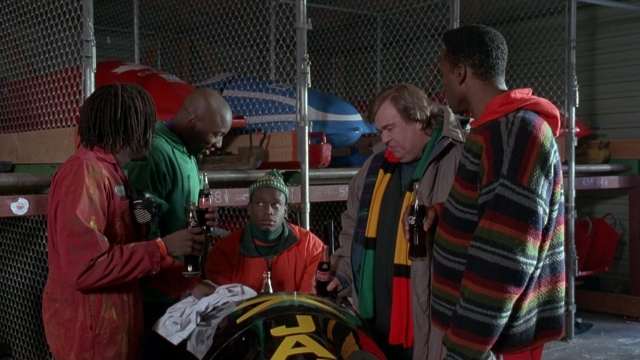 Wide shot frame from Cool Runnings — standing, dialogue, hat
