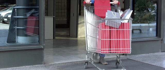 Wide shot frame from Nymphomaniac: Vol. I — door, street, hand