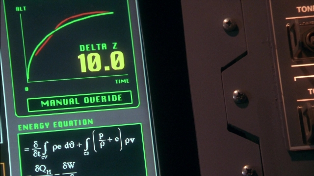 Wide shot frame from Rocketman — digital clock