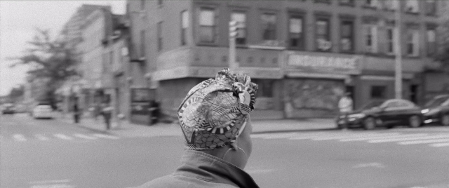 Wide shot frame from The Forty-Year-Old Version — standing, street, car