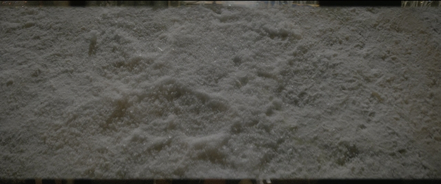 Wide shot frame from The Night Before — street, night, snow