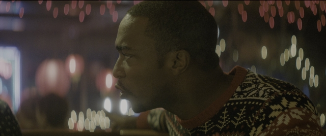 Wide shot frame from The Night Before — room, face, hair