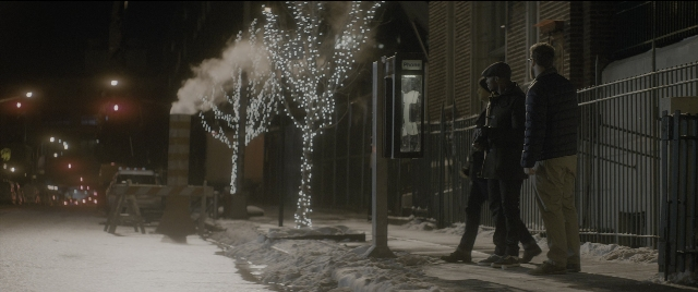 Wide shot frame from The Night Before — standing, street, night