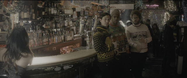 Wide shot frame from The Night Before — standing, dialogue, person