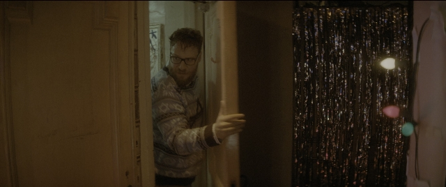 Medium shot frame from The Night Before — people, standing, room