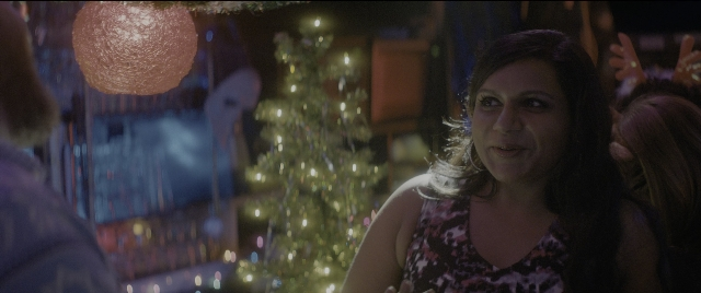 Wide shot frame from The Night Before — standing, night, dress