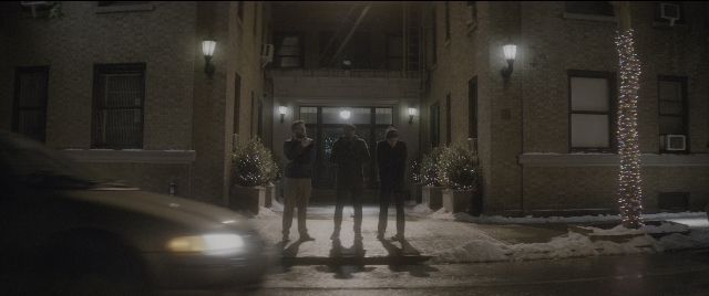 Wide shot frame from The Night Before — standing, dialogue, street