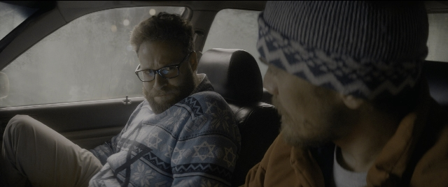 Frame from The Night Before — sitting, dialogue, street