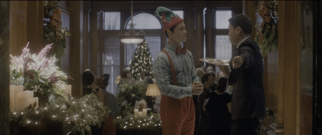 Wide shot frame from The Night Before — standing, plate, room