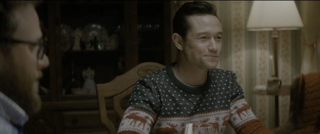 Wide shot frame from The Night Before — sitting, room, table
