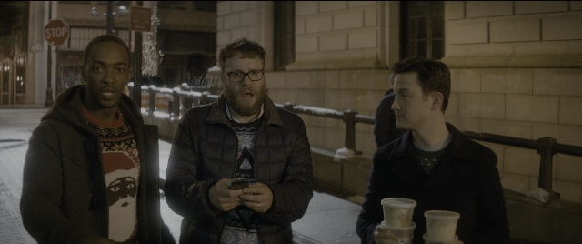 Wide shot frame from The Night Before — standing, dialogue, phone